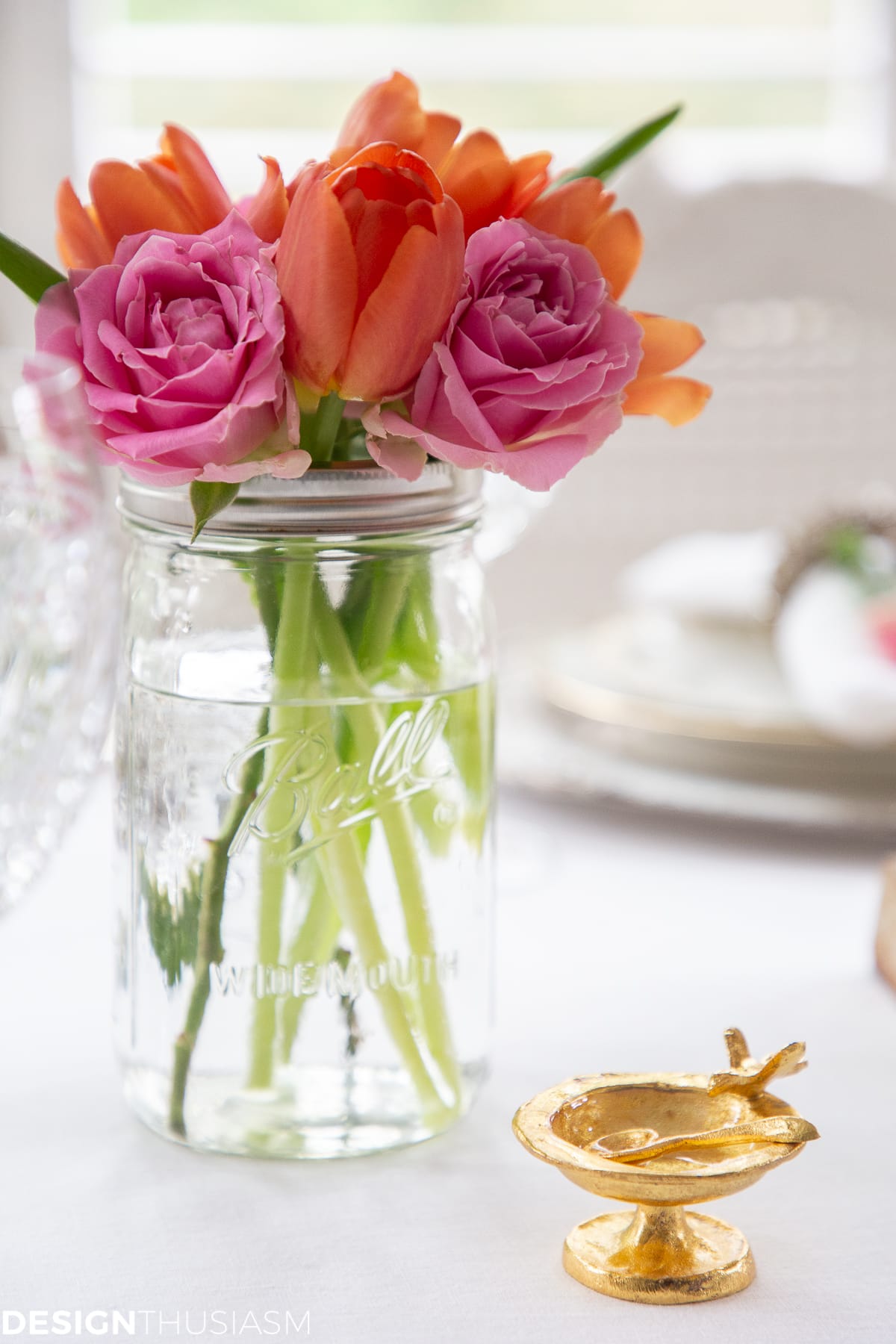 pink and orange flowers in a summer table setting