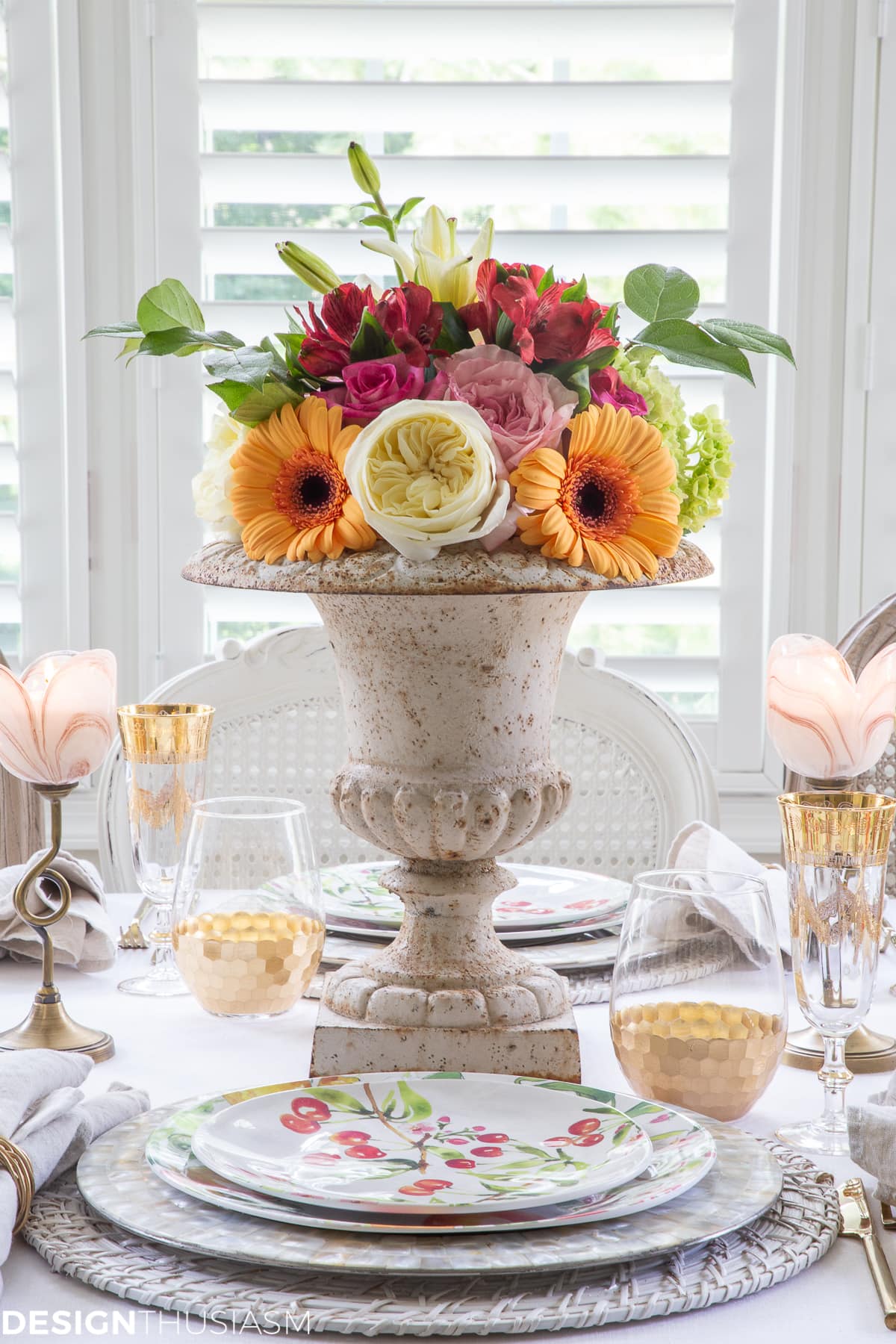 informal table setting with flowers in garden urn