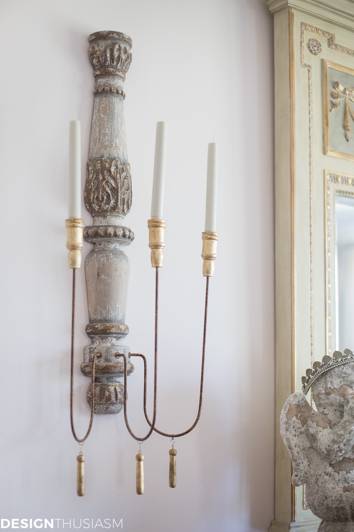 french country home with distressed sconces