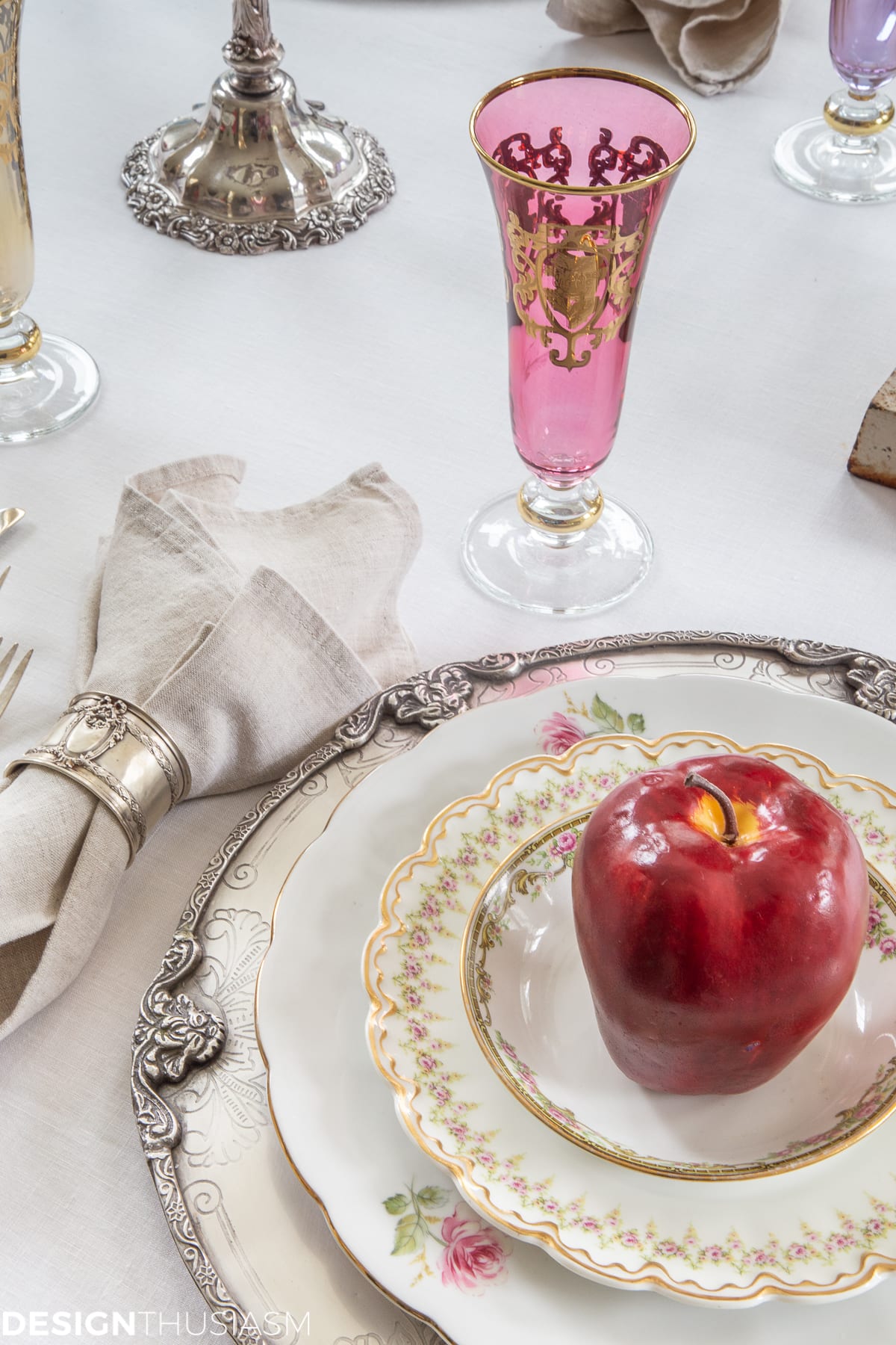 fall table with pretty china and apples on the plates