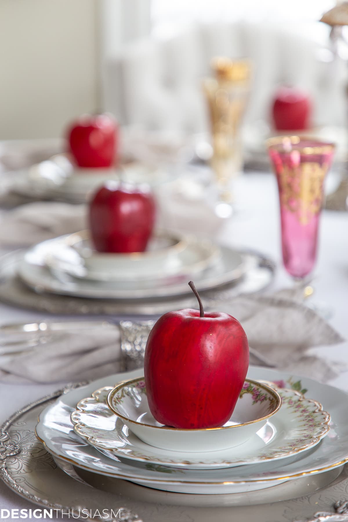 fall table setting with apples on the plates