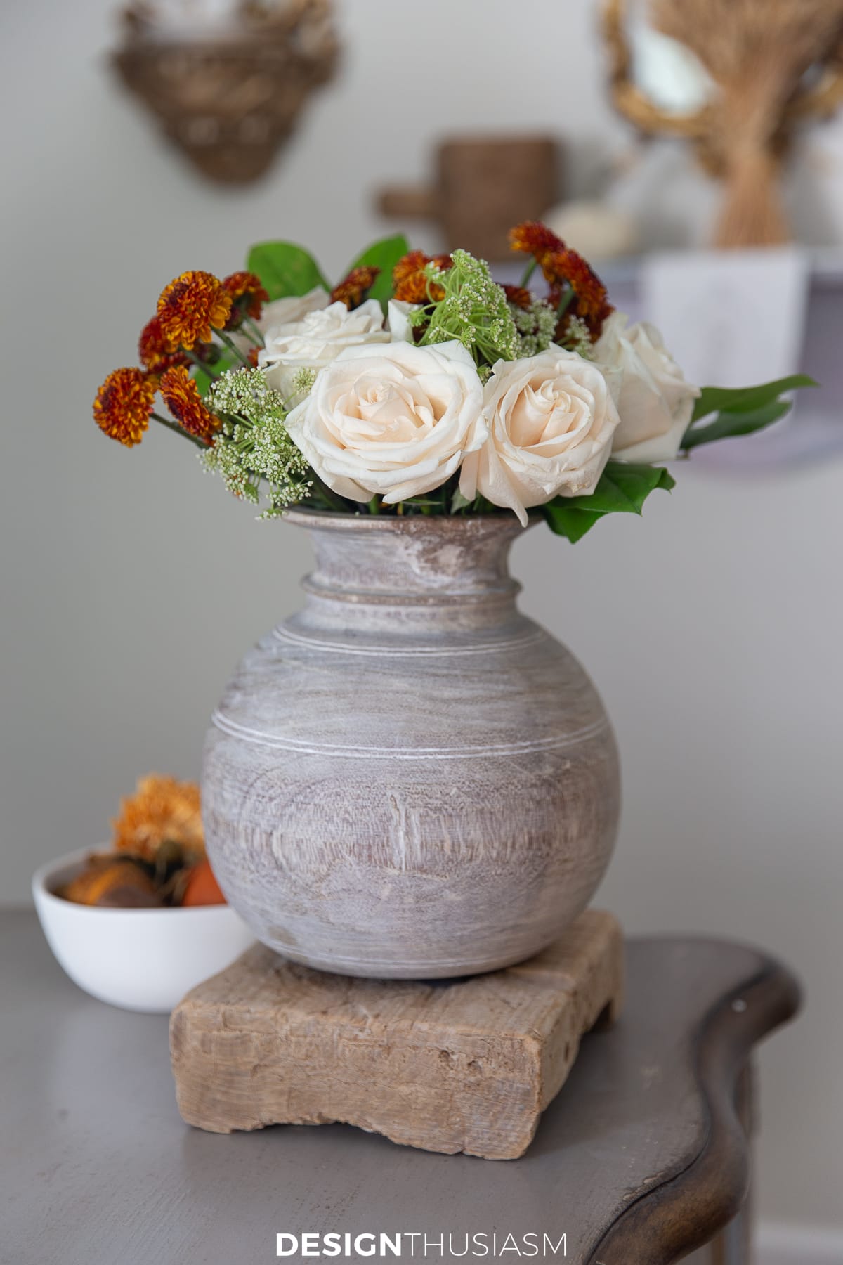 fall flowers on the desk in the study
