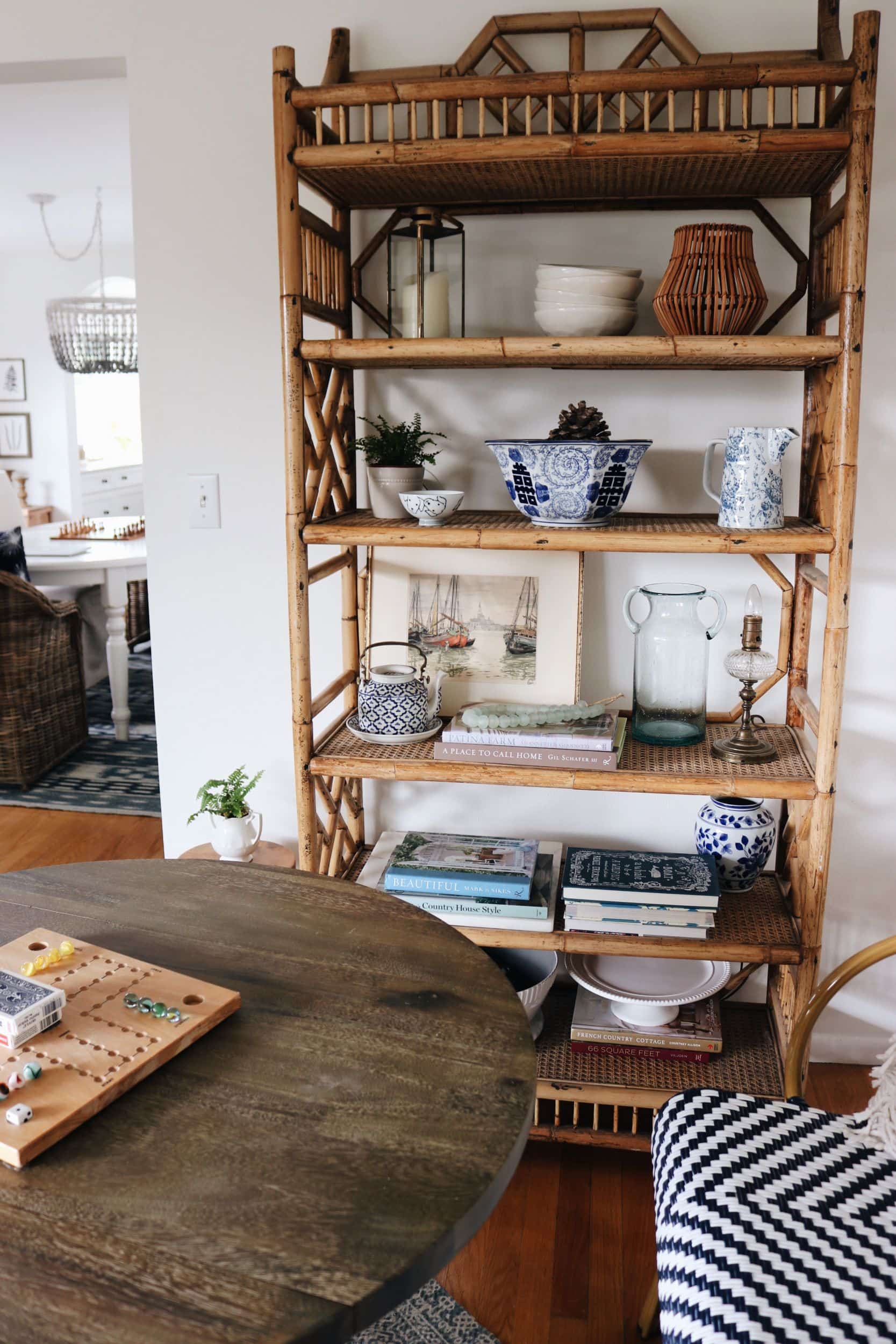 Game-table-with-rattan-bookshelf-coastal-style-the-inspired-room