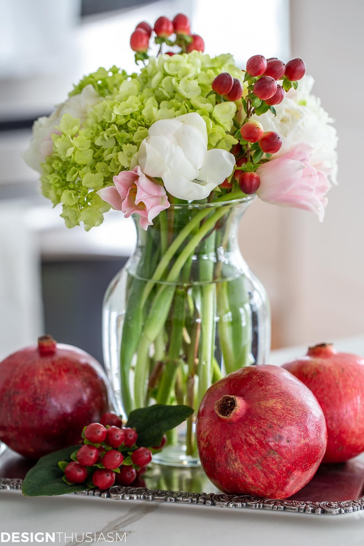 holiday vignette with flowers and pomegranates