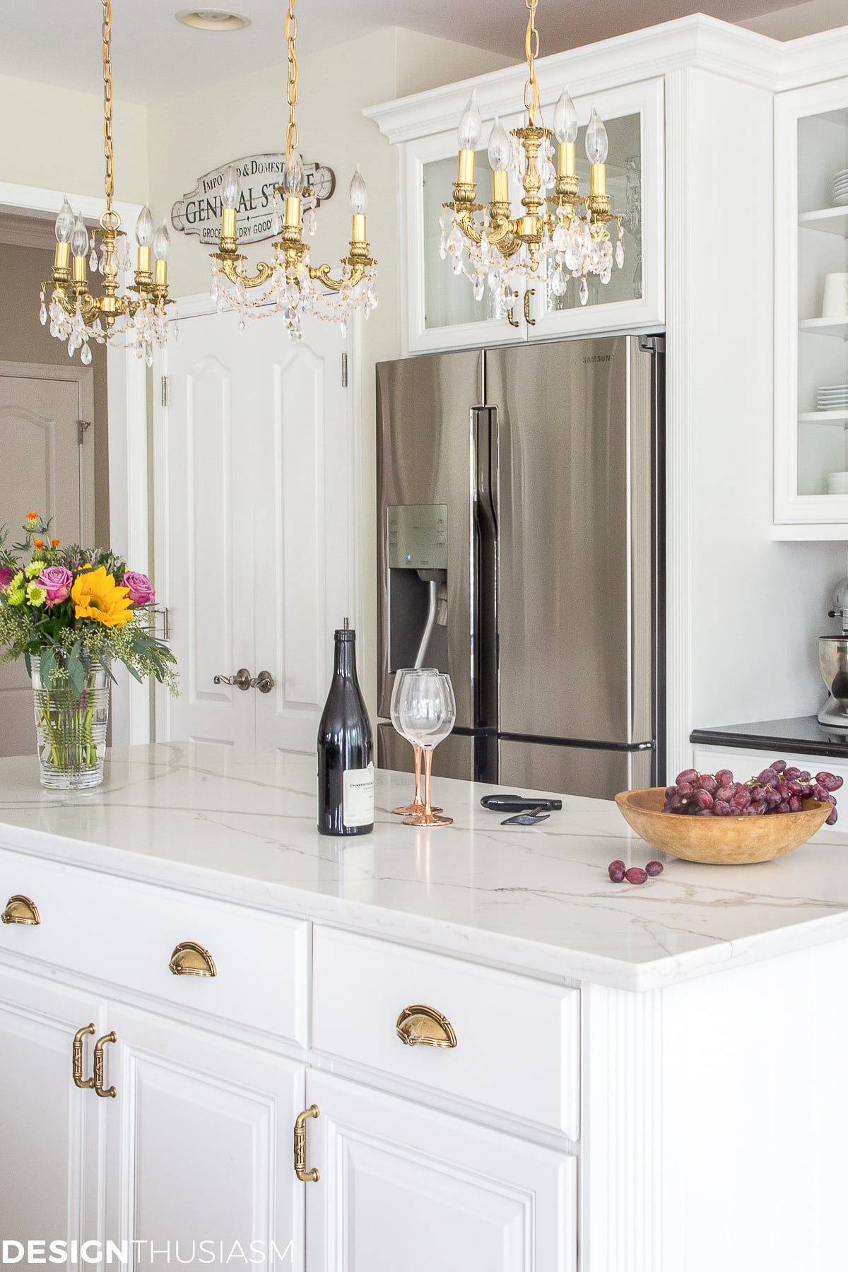white kitchen with pantry doors