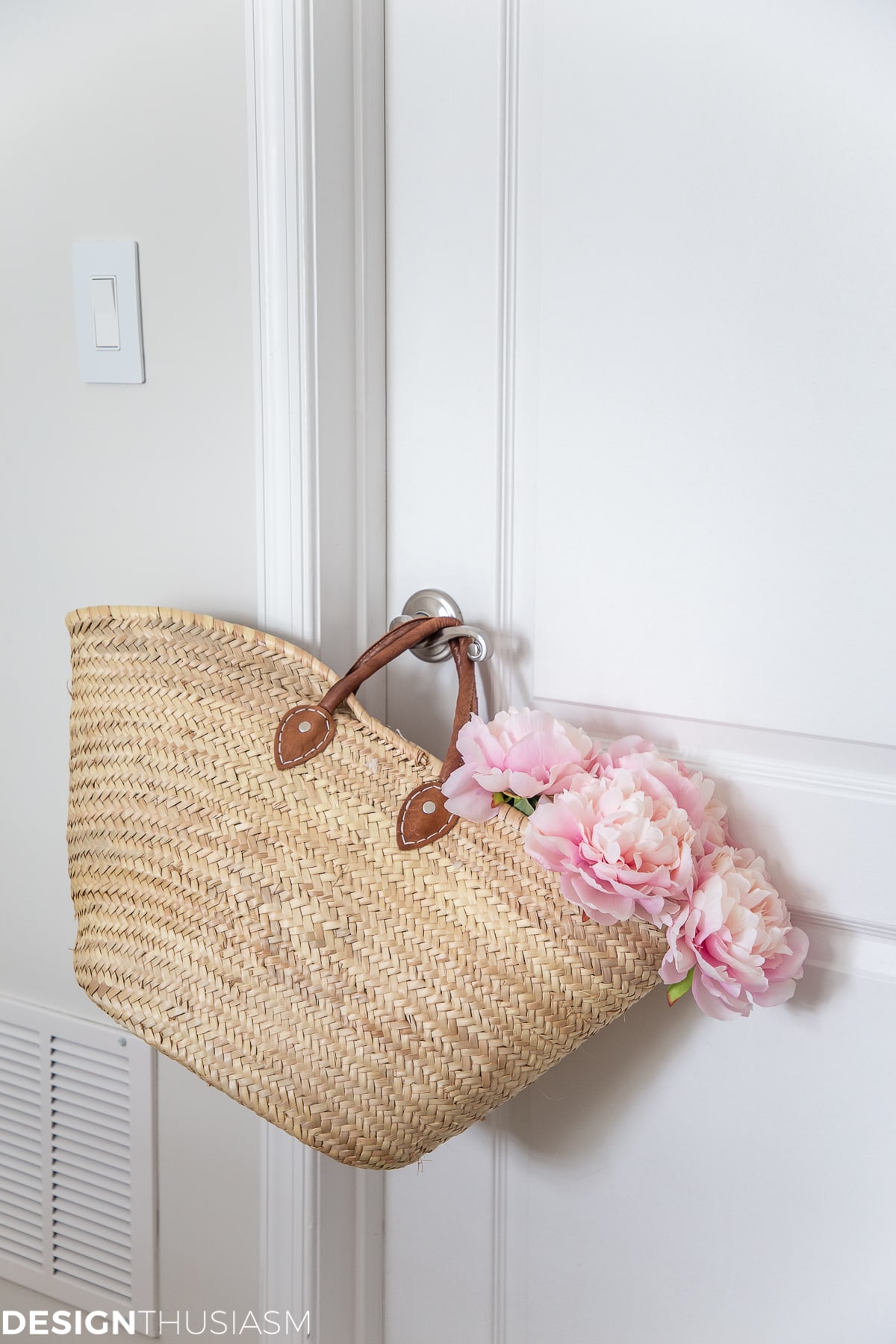white bedroom with peonies in a market basket
