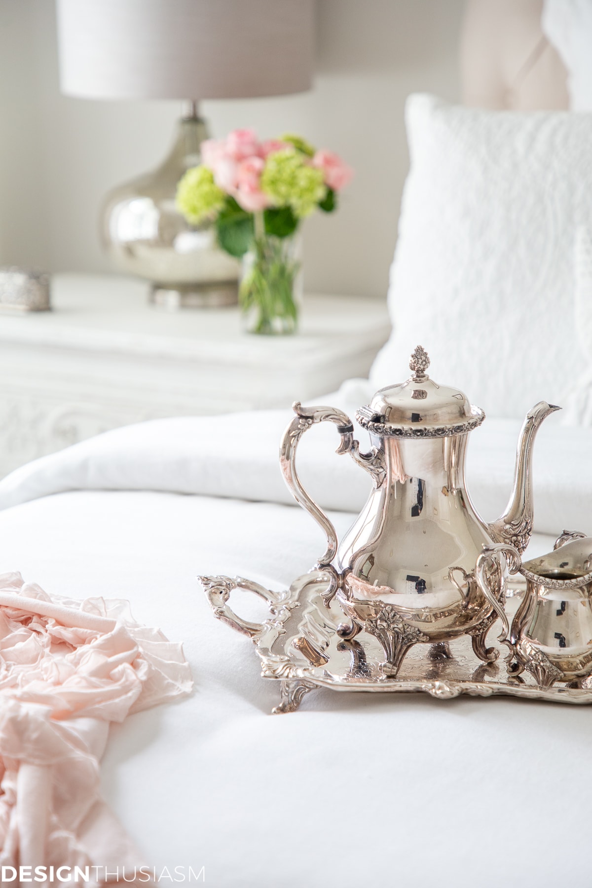 white bedroom with silver tea set
