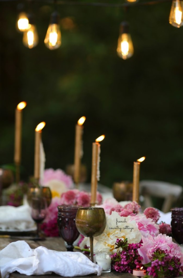 Candles and peonies on the table