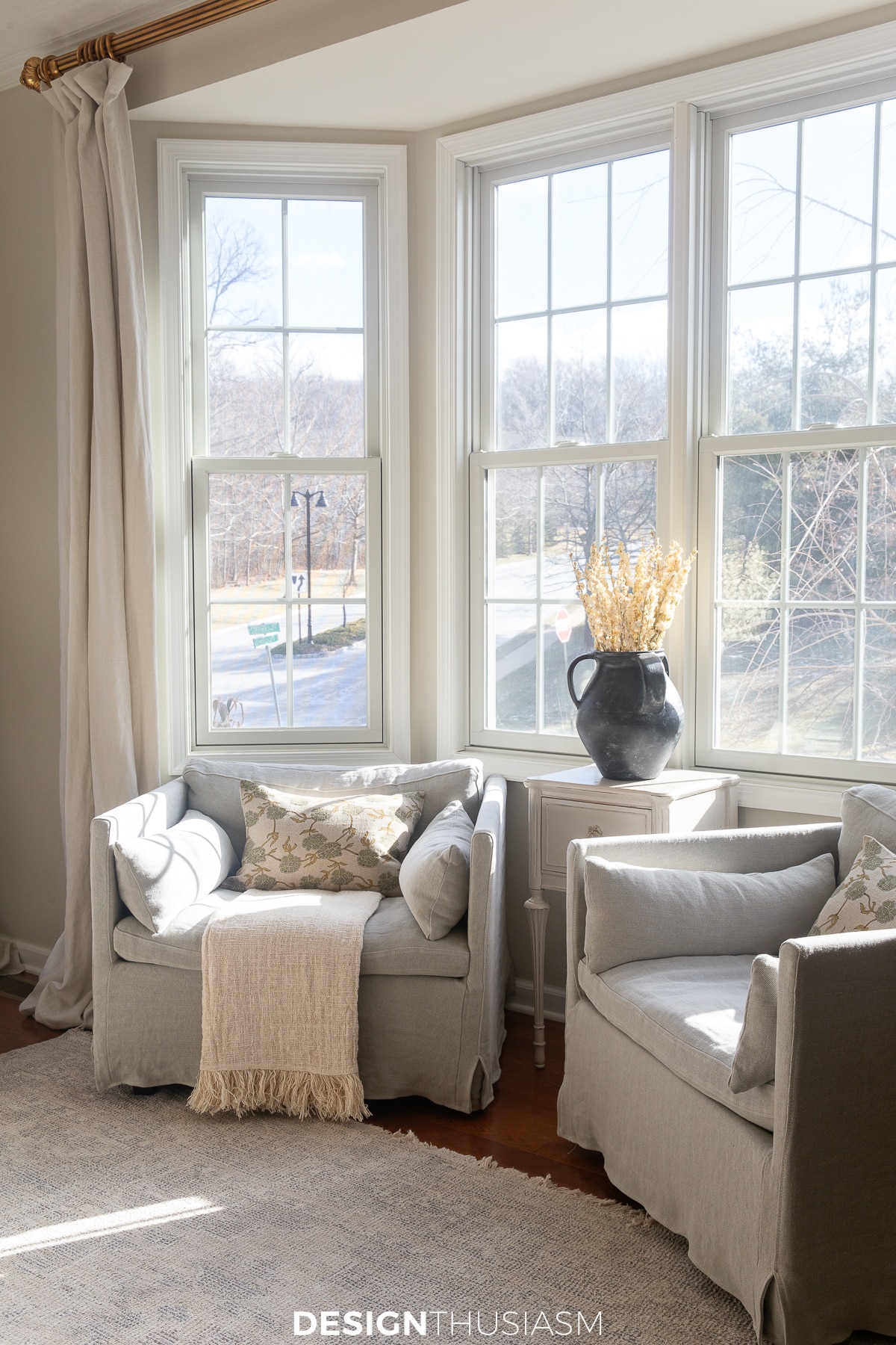 linen club chairs by the window