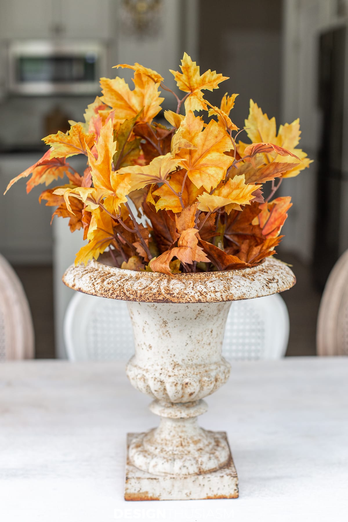 fall leaves in a garden urn