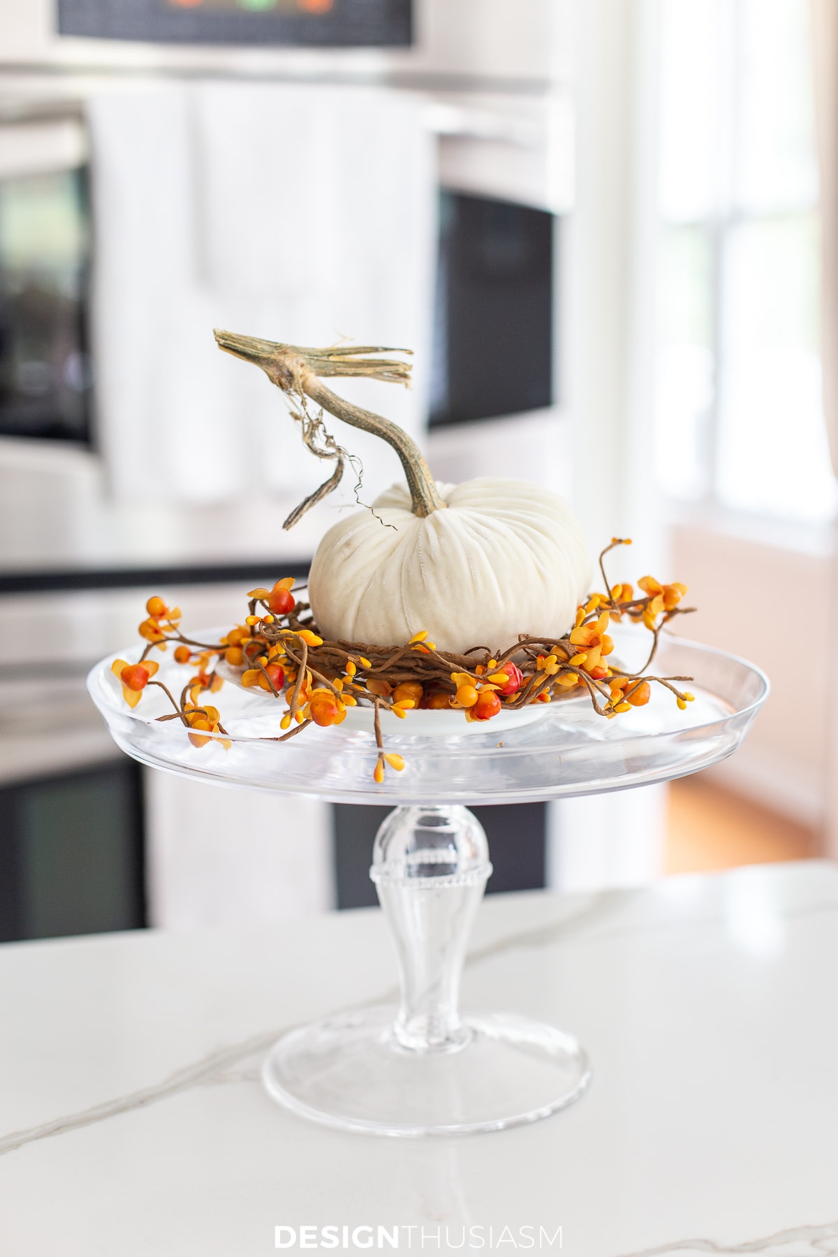 velvet pumpkin and fall berries on a cake plate