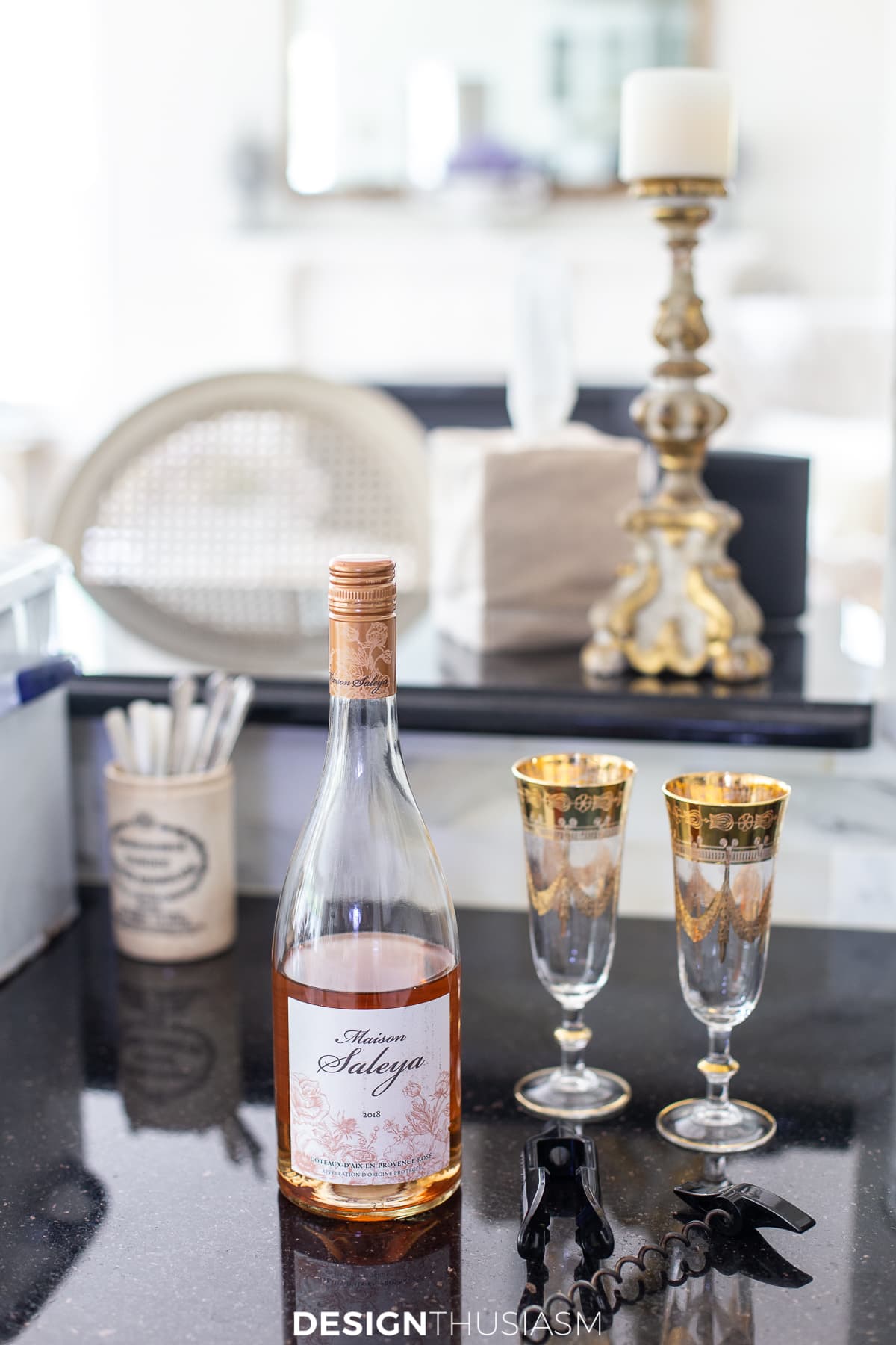 rose wine and gold rimmed wine glasses