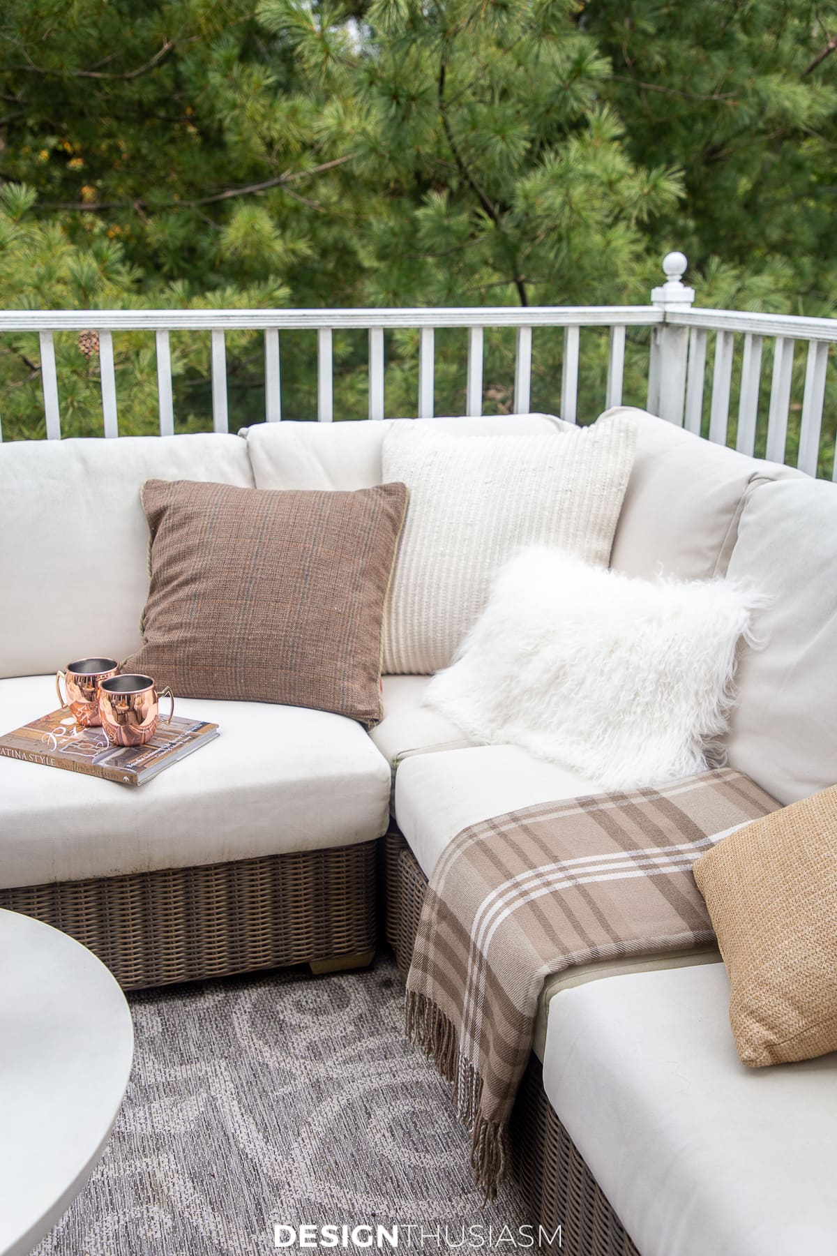 fall pillows and throws on the porch