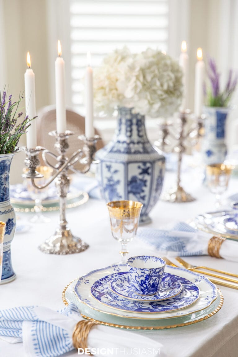 blue and white china table setting with white hydrangeas