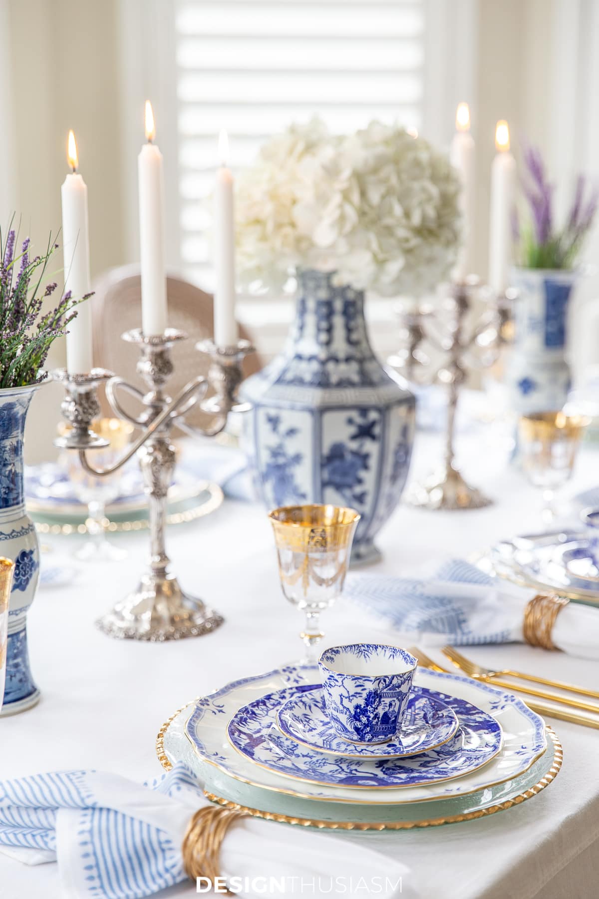 blue and white china table setting with white hydrangeas