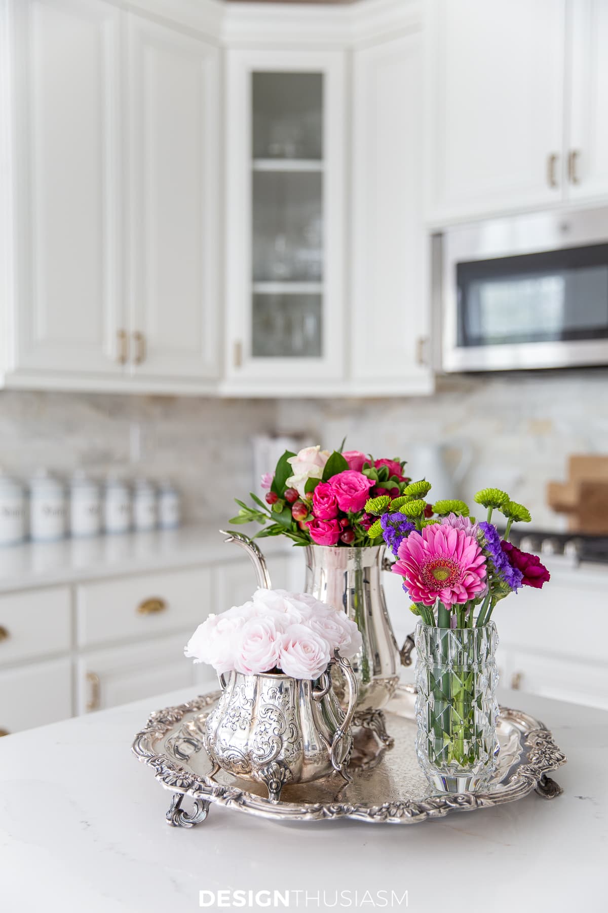 pink flowers in a white kitchen