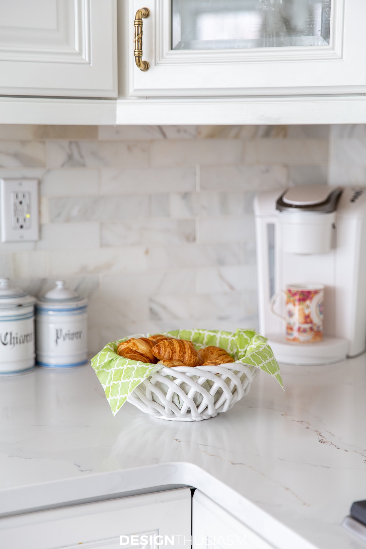 white quartz countertops and marble backsplash