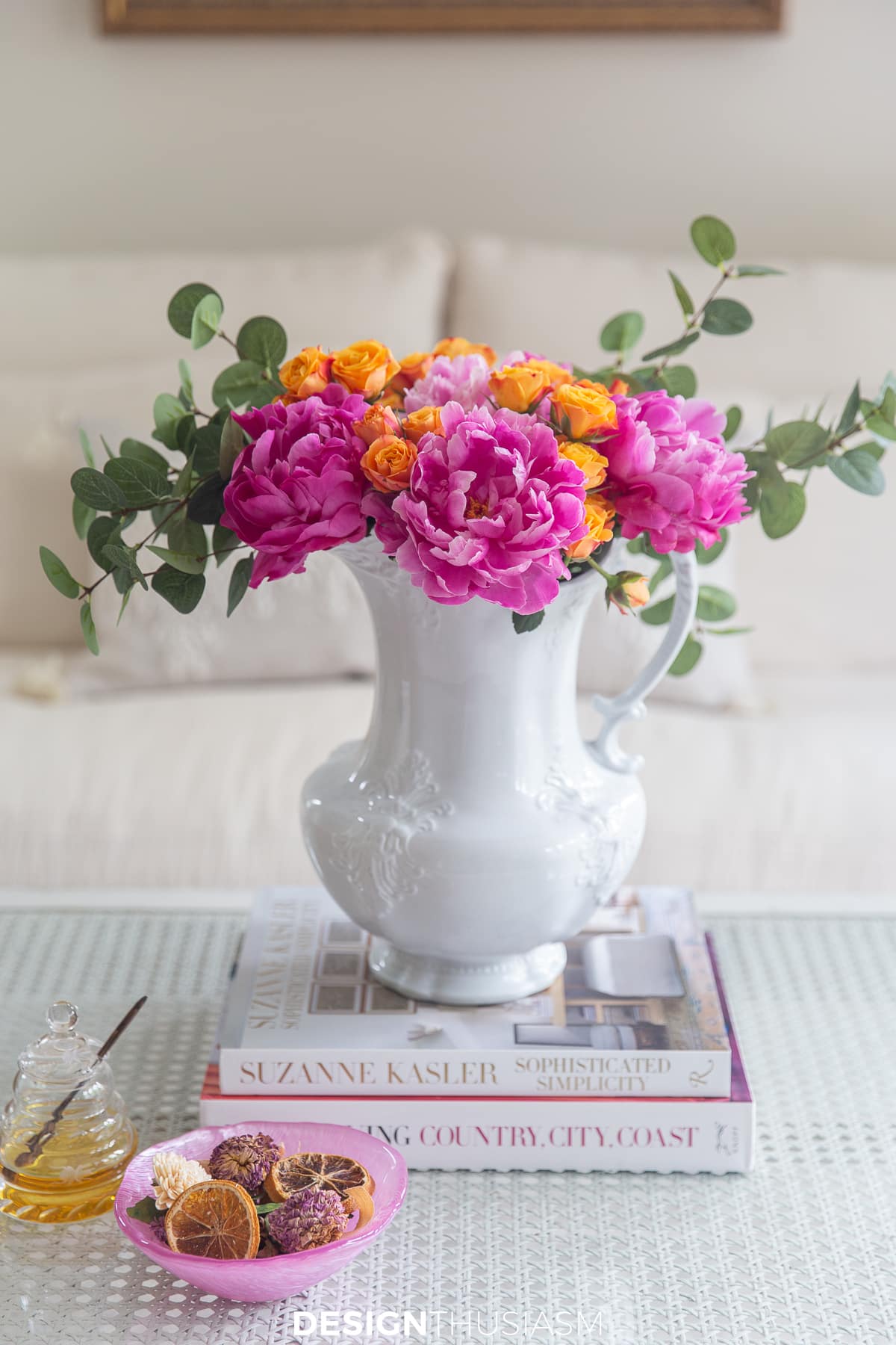 summer living room with pink peonies and orange spray roses