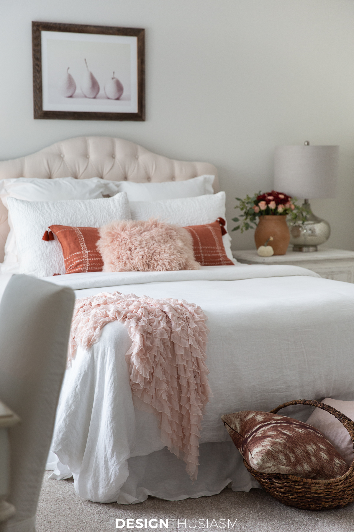 Fall bedroom decor in a white bedroom