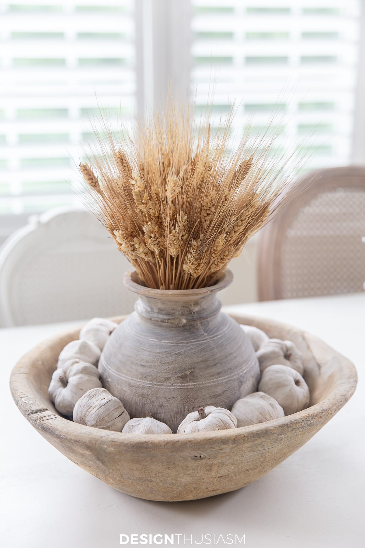 wheatstalks in vintage wood vase, vintage wood bowl filled with white craft pumpkins