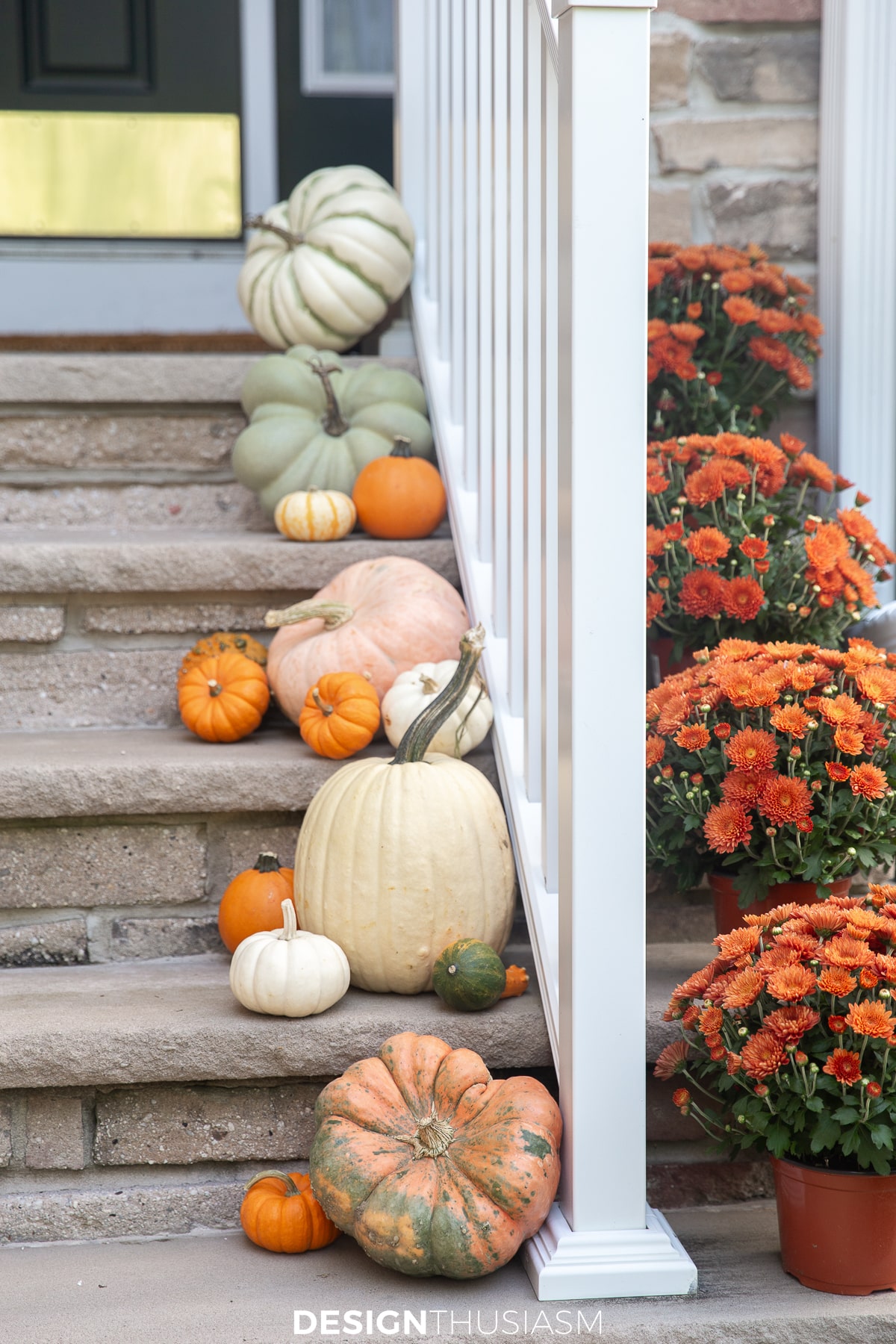fall front porch with pumpkins and mums