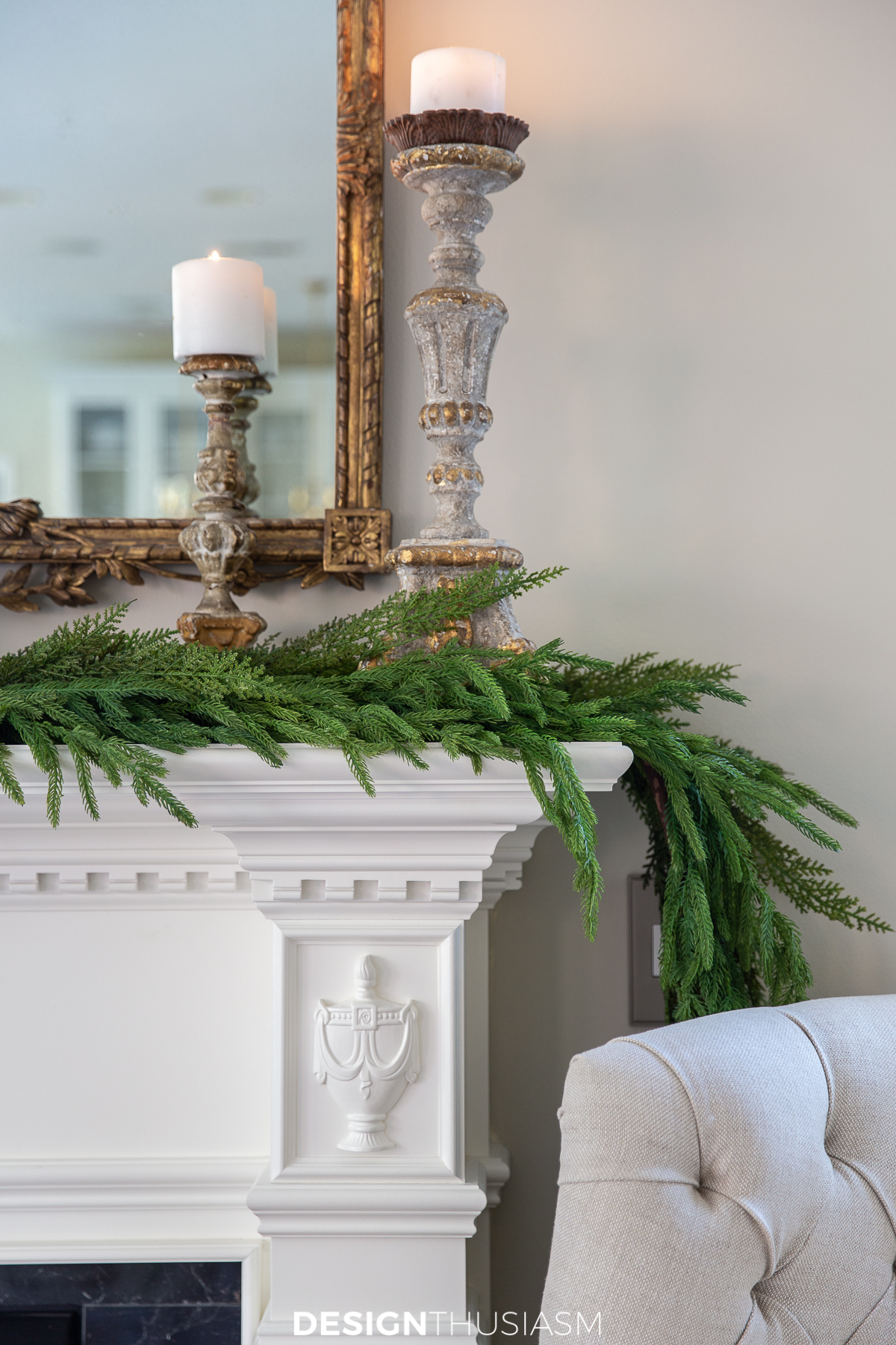 holiday family room with mantel garland and candlesticks