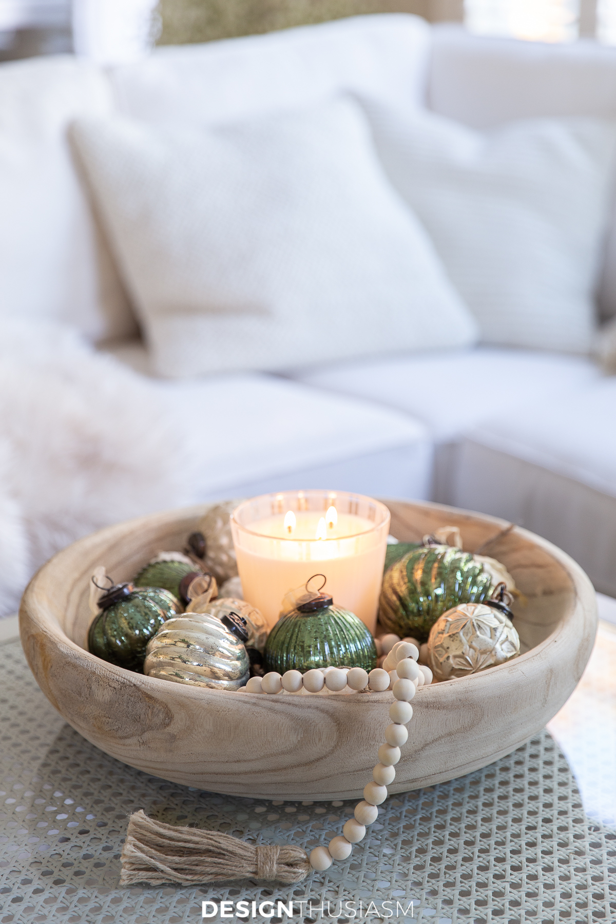 holiday family room with ornaments in a wood bowl