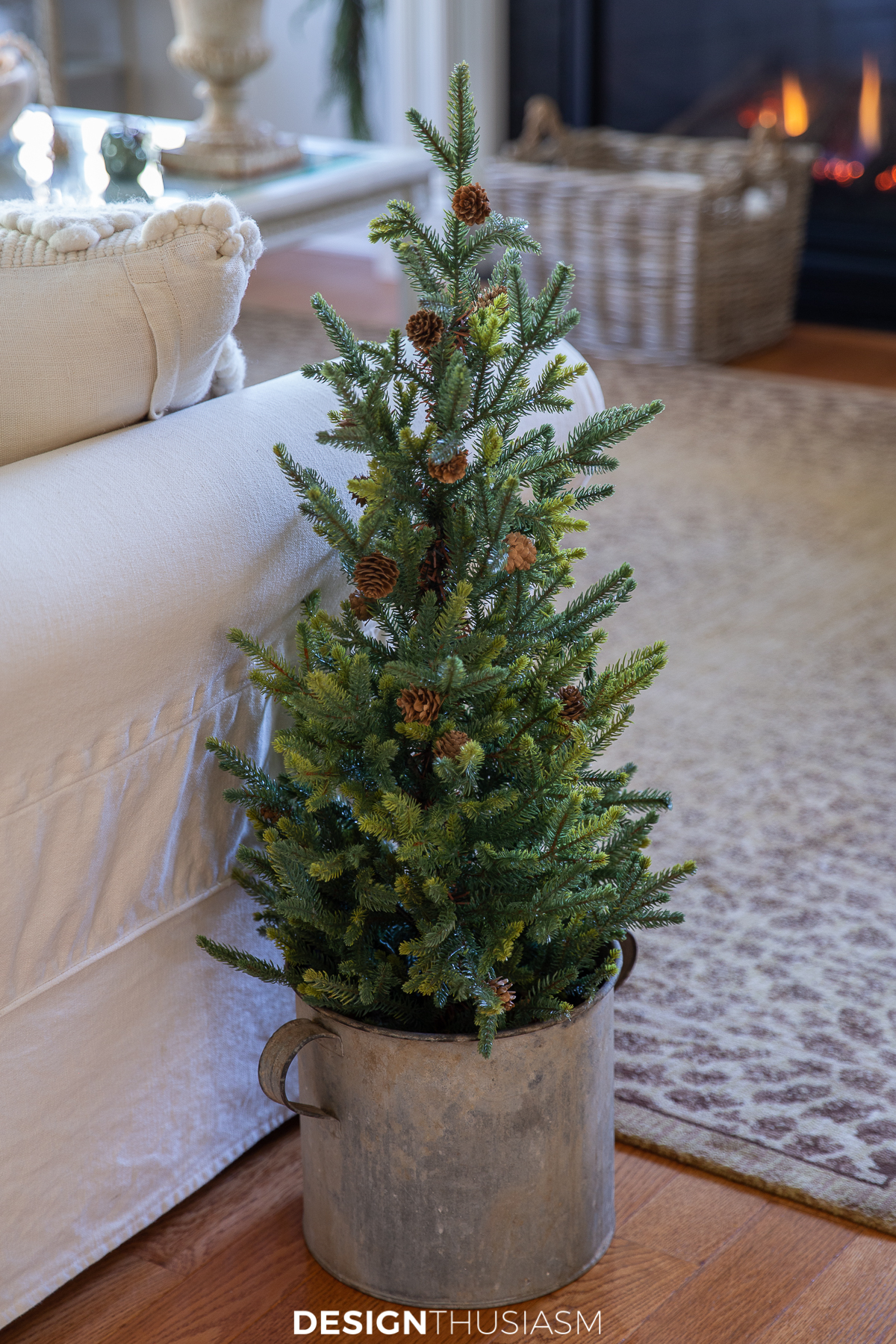 holiday family room with small tree in a vintage zinc bucket