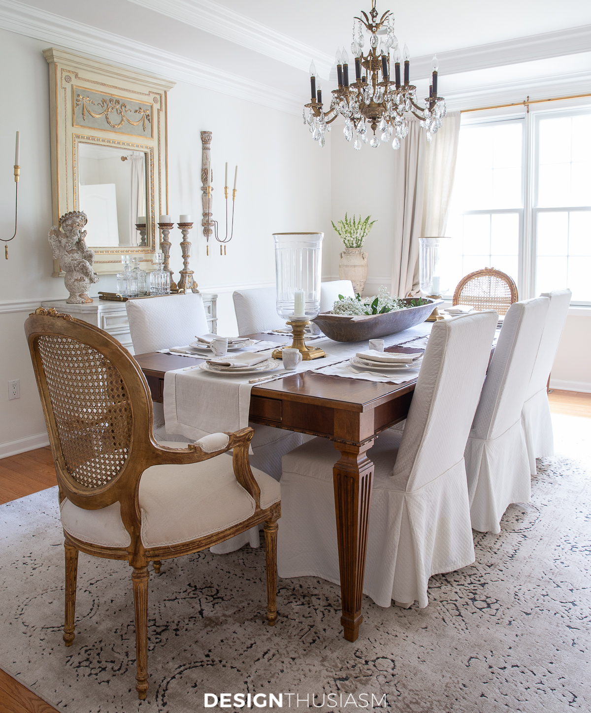 dining room table with slipcovered chairs