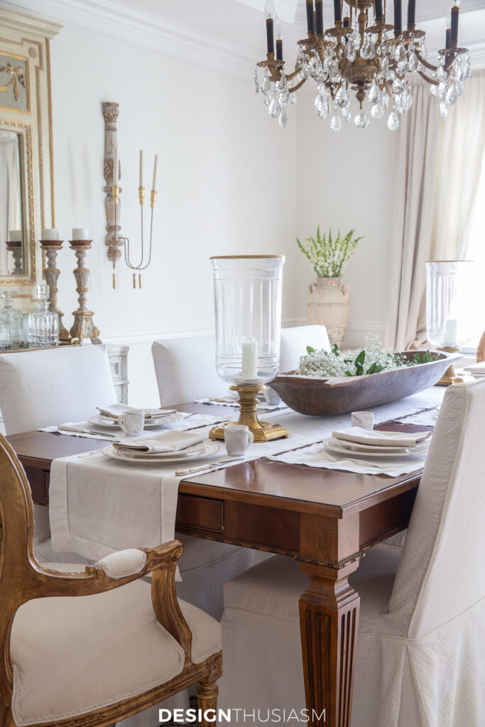 dining room table with hurricane lamps