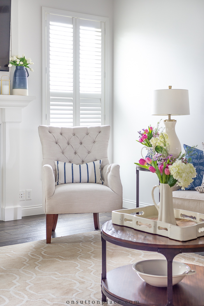 neutral living room with blue accents on sutton place