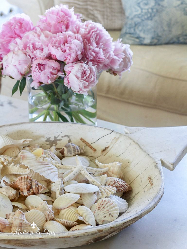 seashells in a wooden bowl