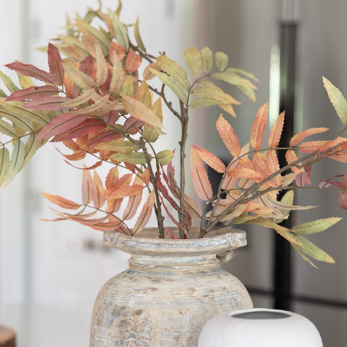 fall branches in a vintage wood vase