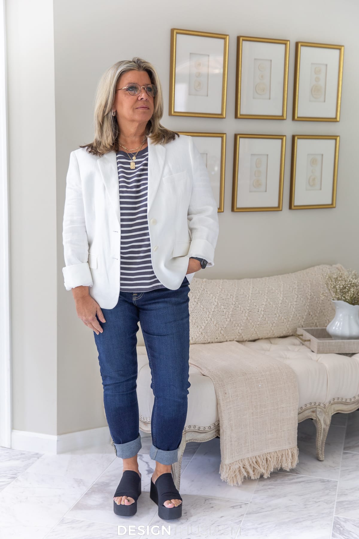 white jacket with striped tee and dark jeans