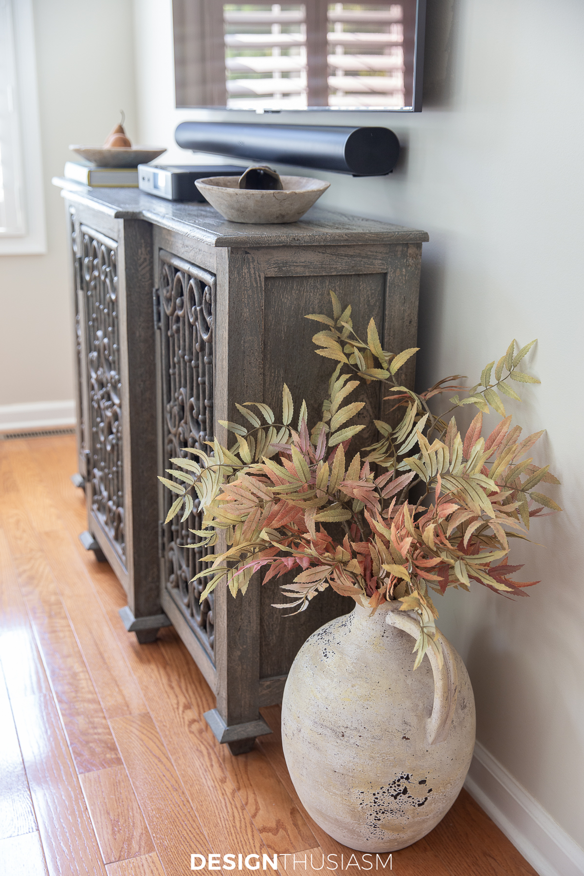 fall branches in vase on the floor