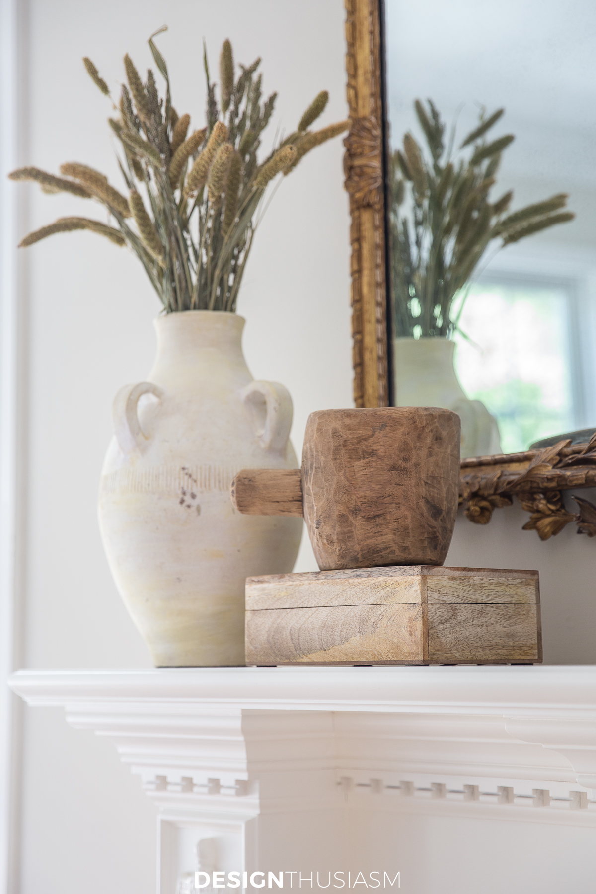 fall branches in vase on the mantel