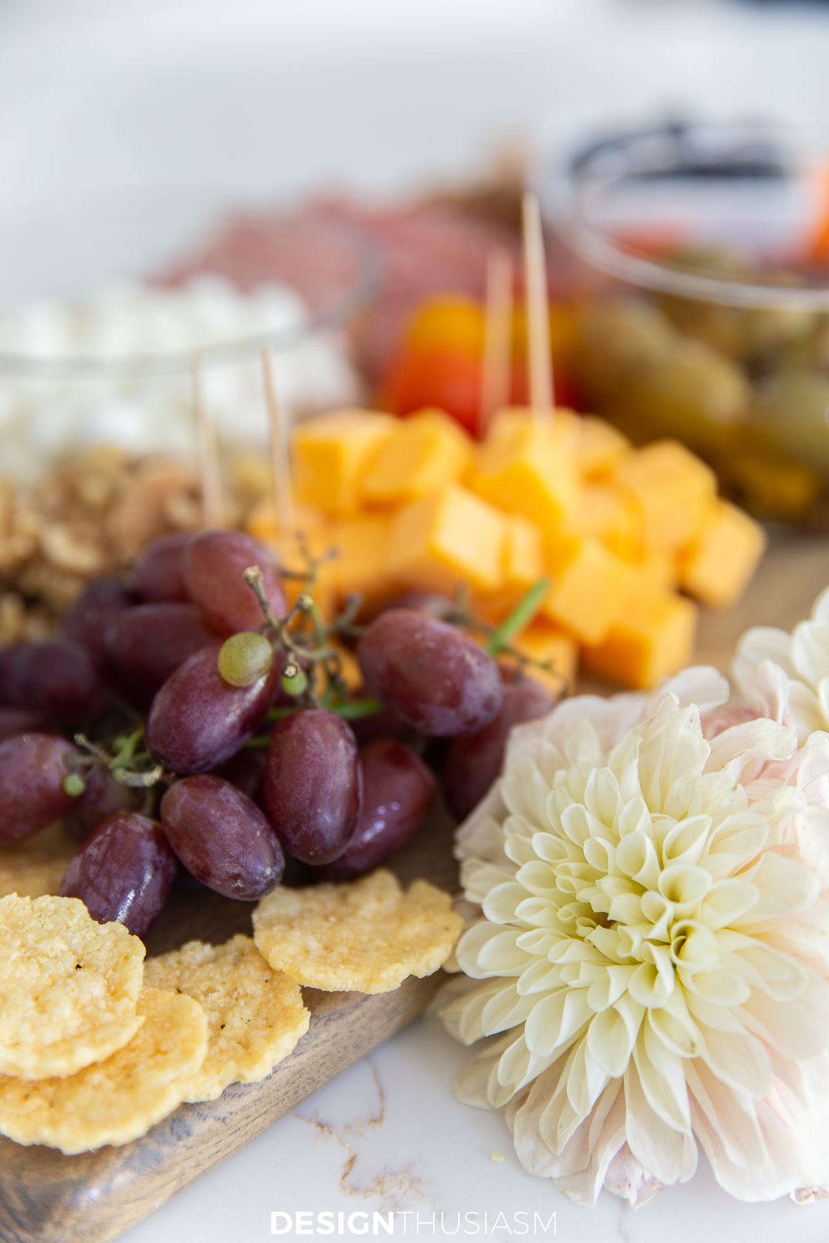 grapes and cheese on charcuterie board