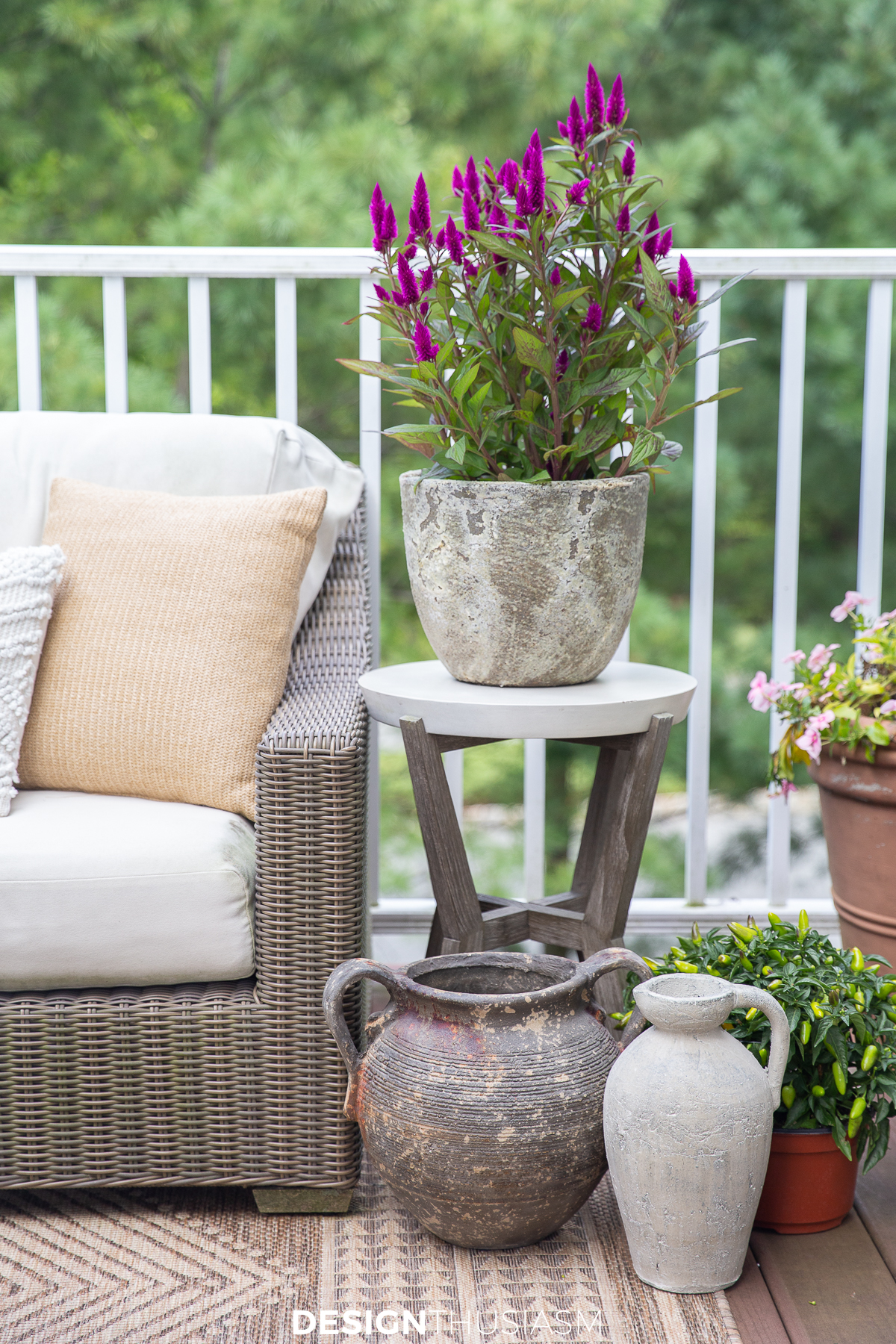 small patio with planters and vases