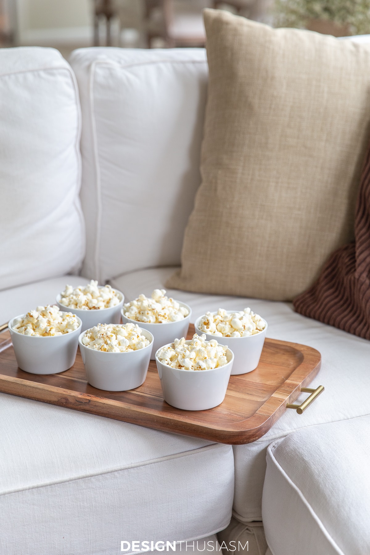 popcorn bowls on a wood tray