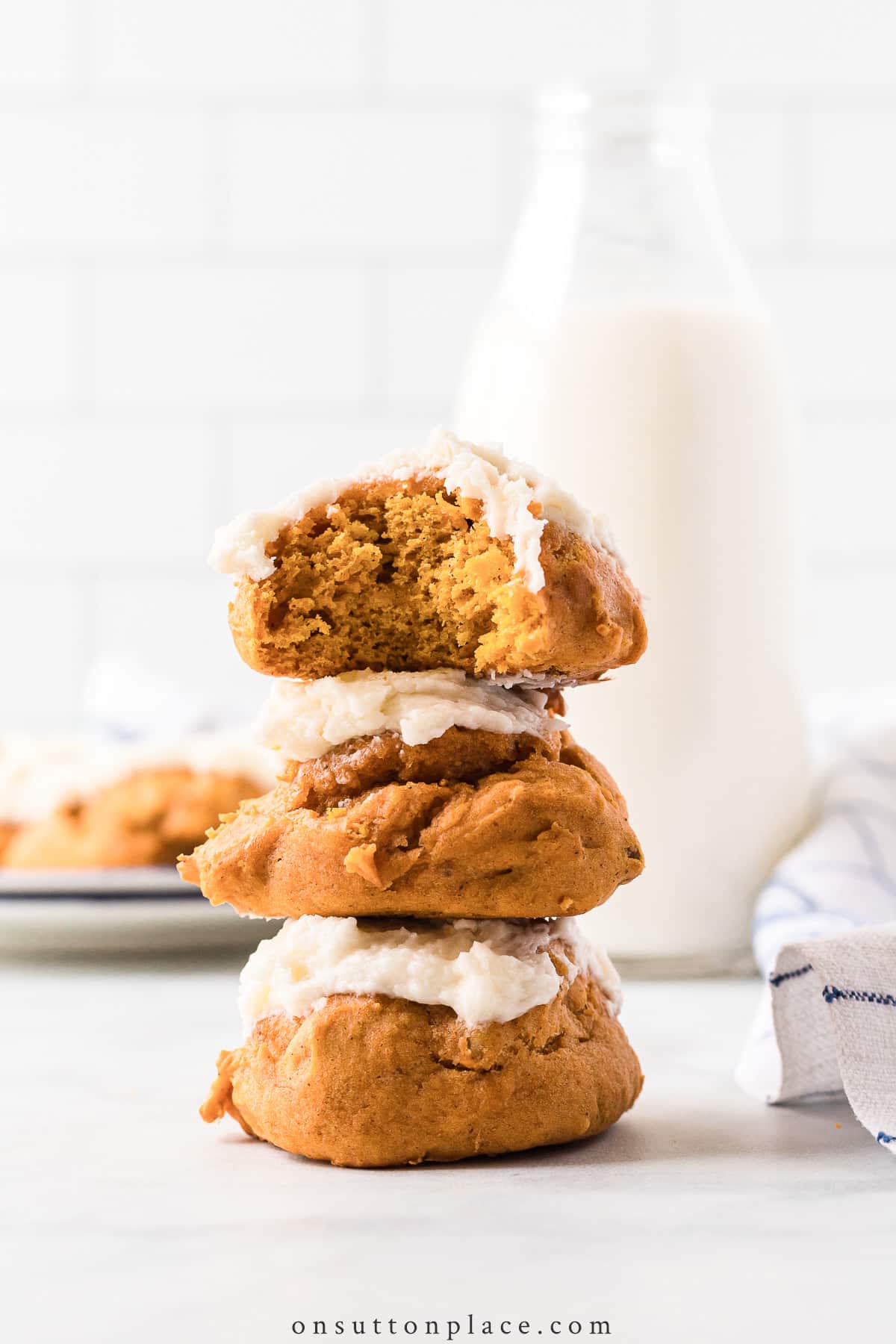 stacked iced pumpkin cookies