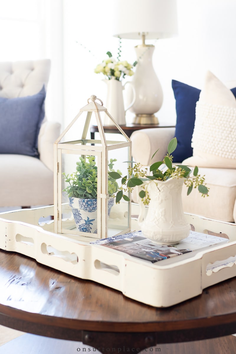 coffee table decor lantern books small pitcher