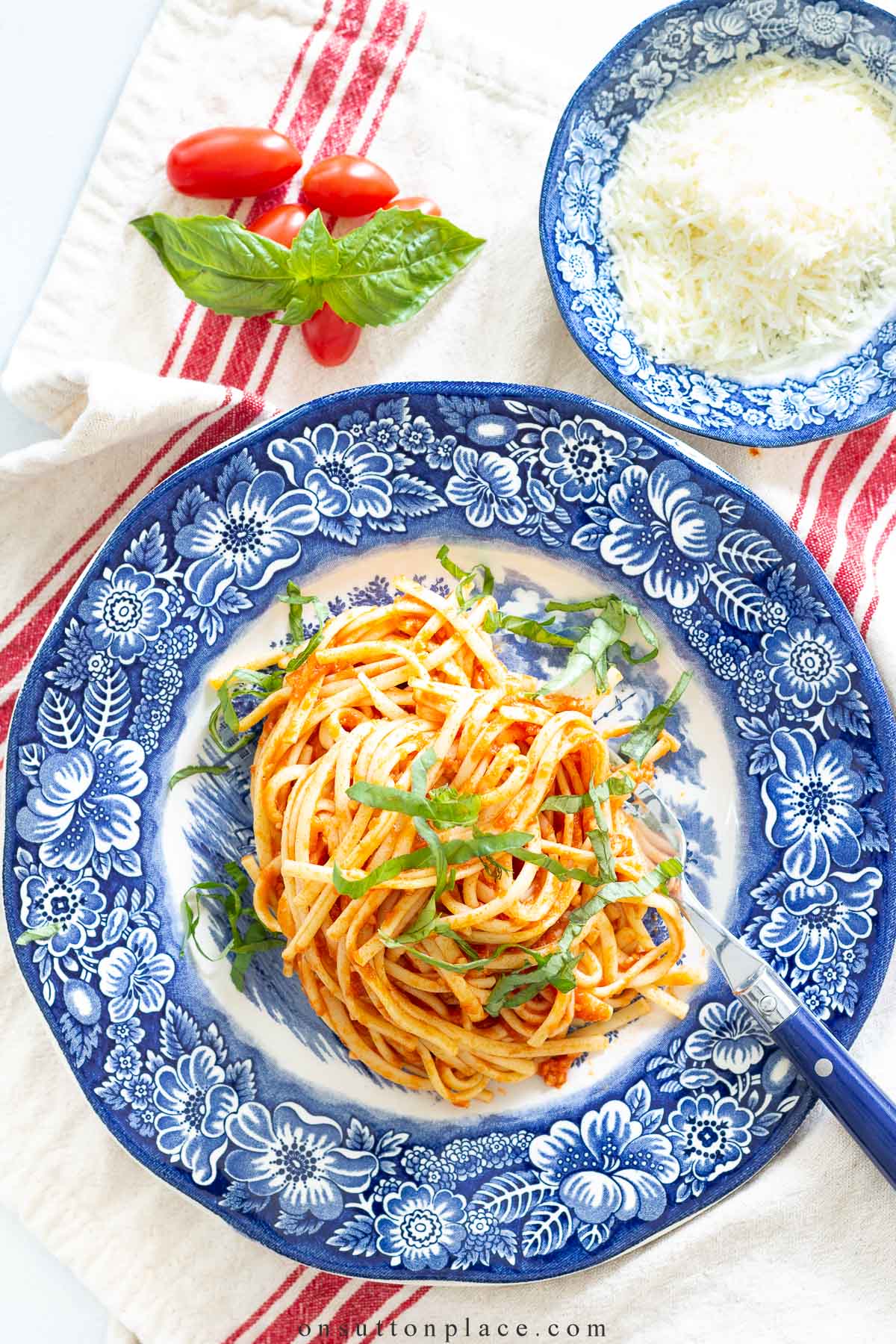 linguine with homemade spaghetti sauce on blue plate