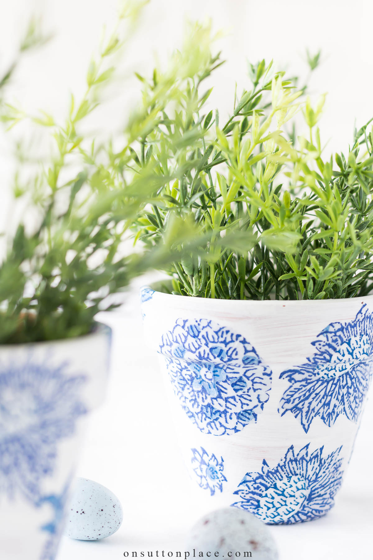 faux greenery in diy mod podge pot