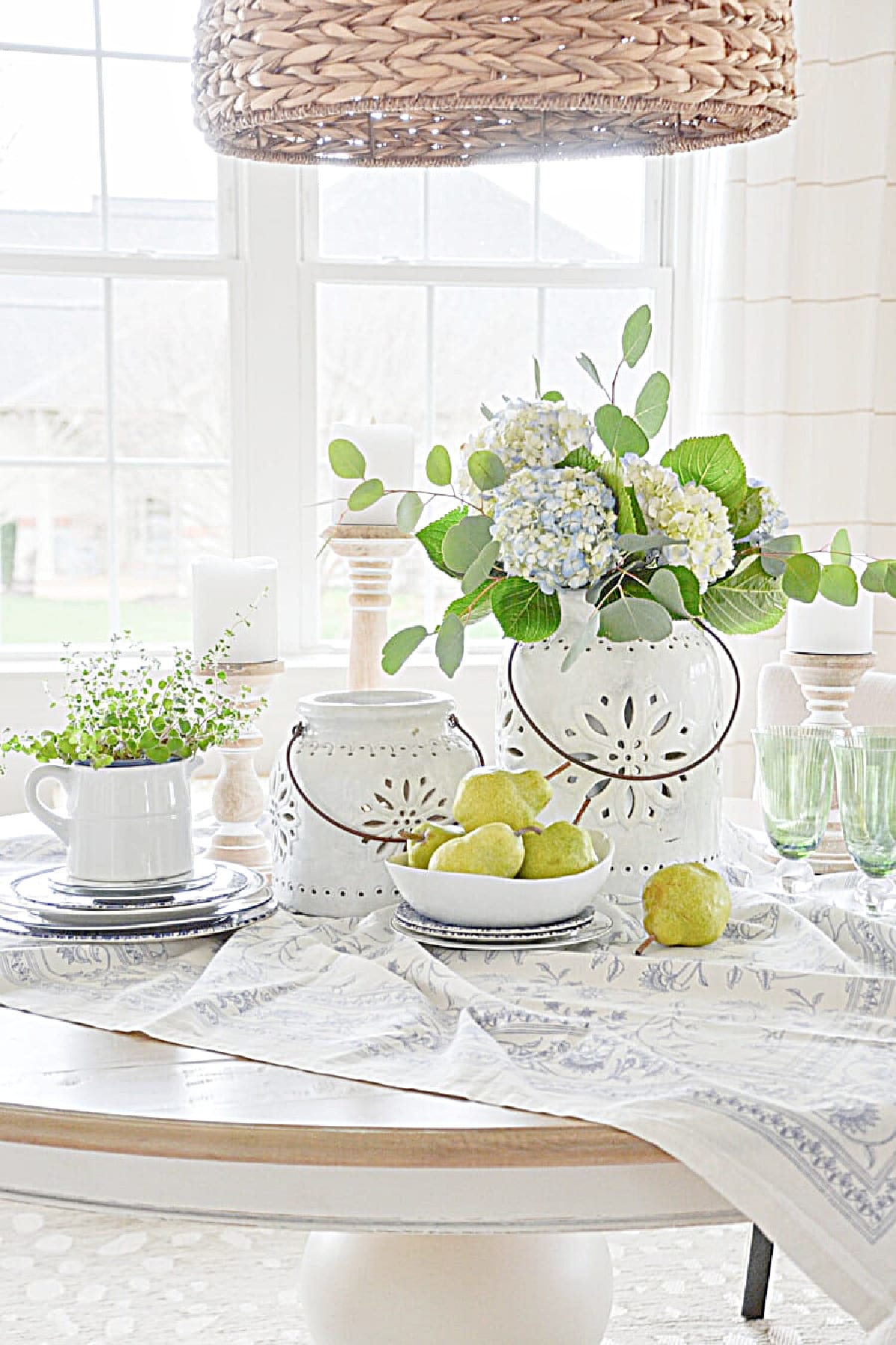 white vases on a dining table