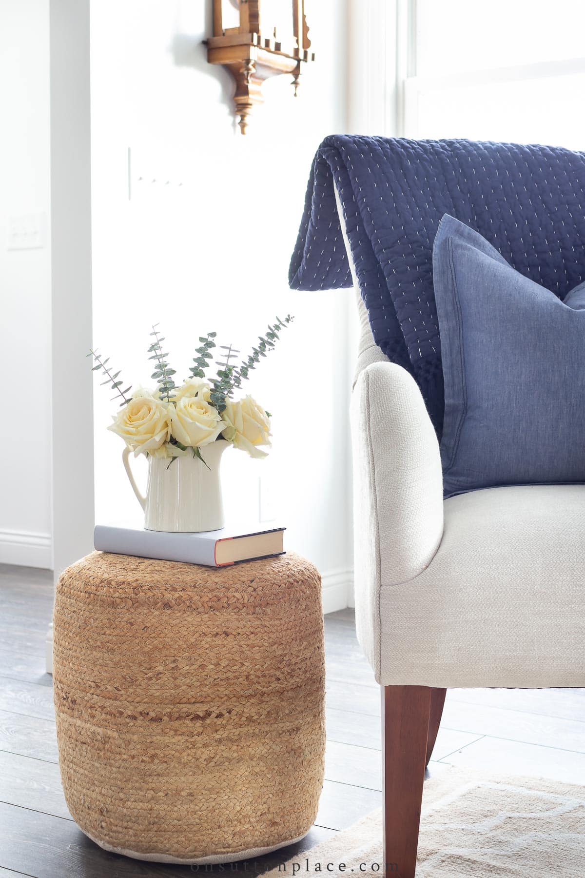 rattan side table beside beige chair