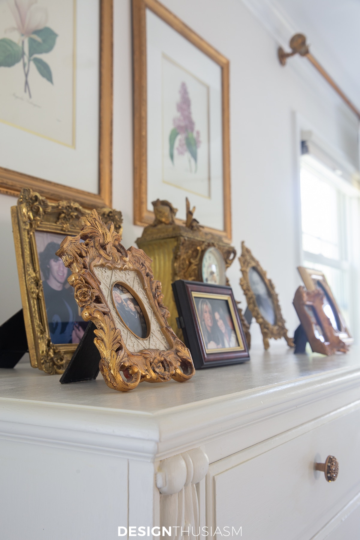 tall gentleman's chest decorated with photo frames