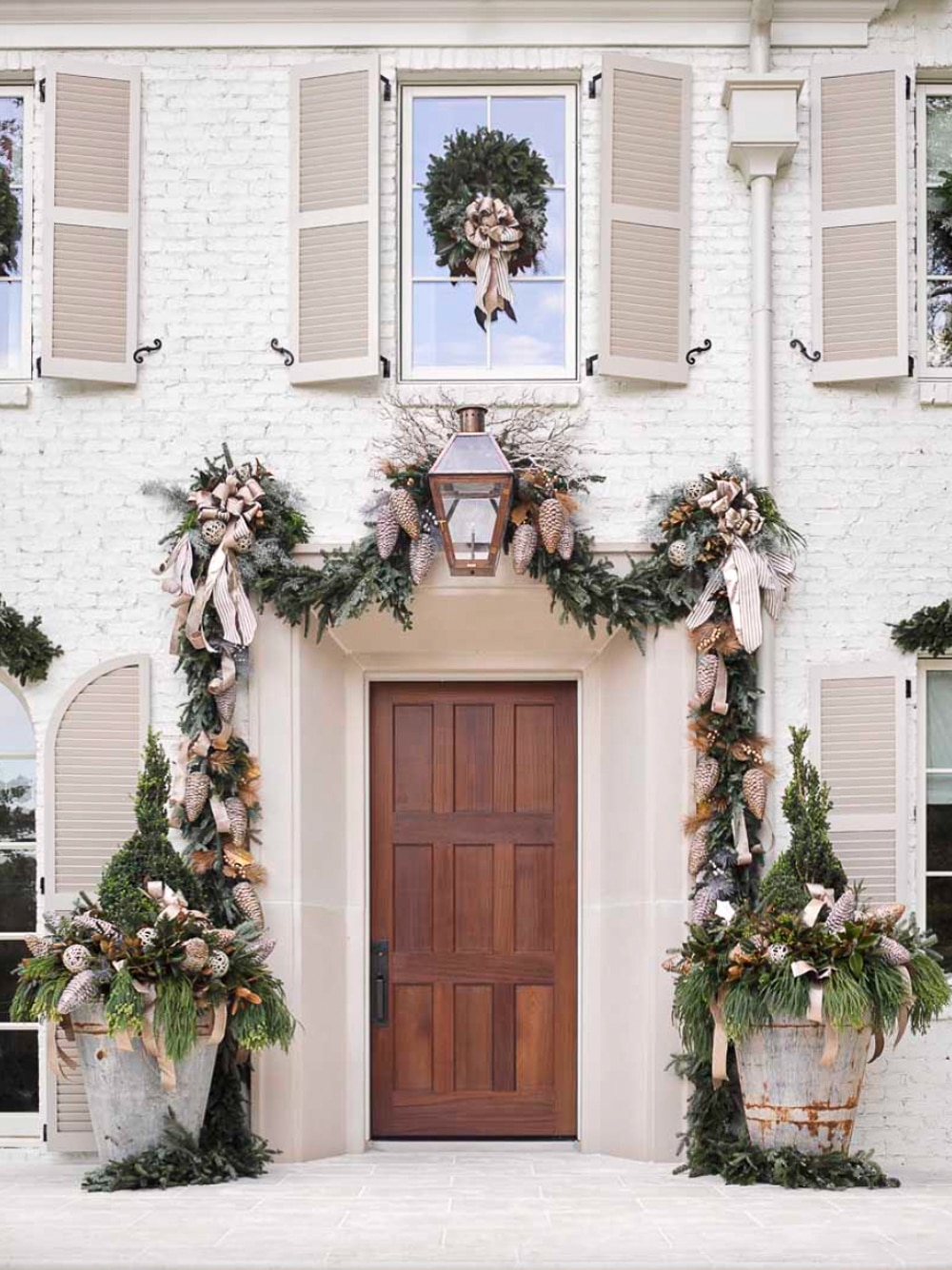 Christmas porch with garlands and planters