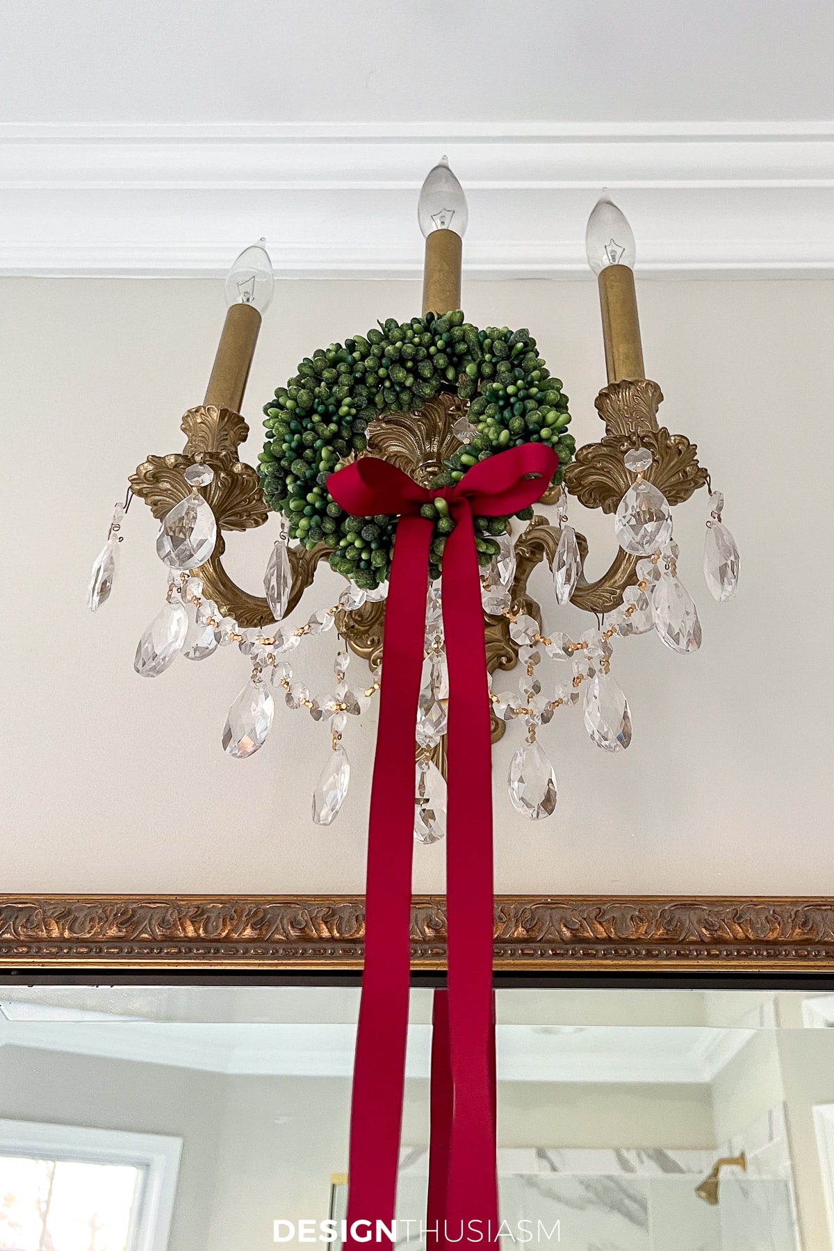 christmas decorations for the bathroom with mini wreaths on the sconces