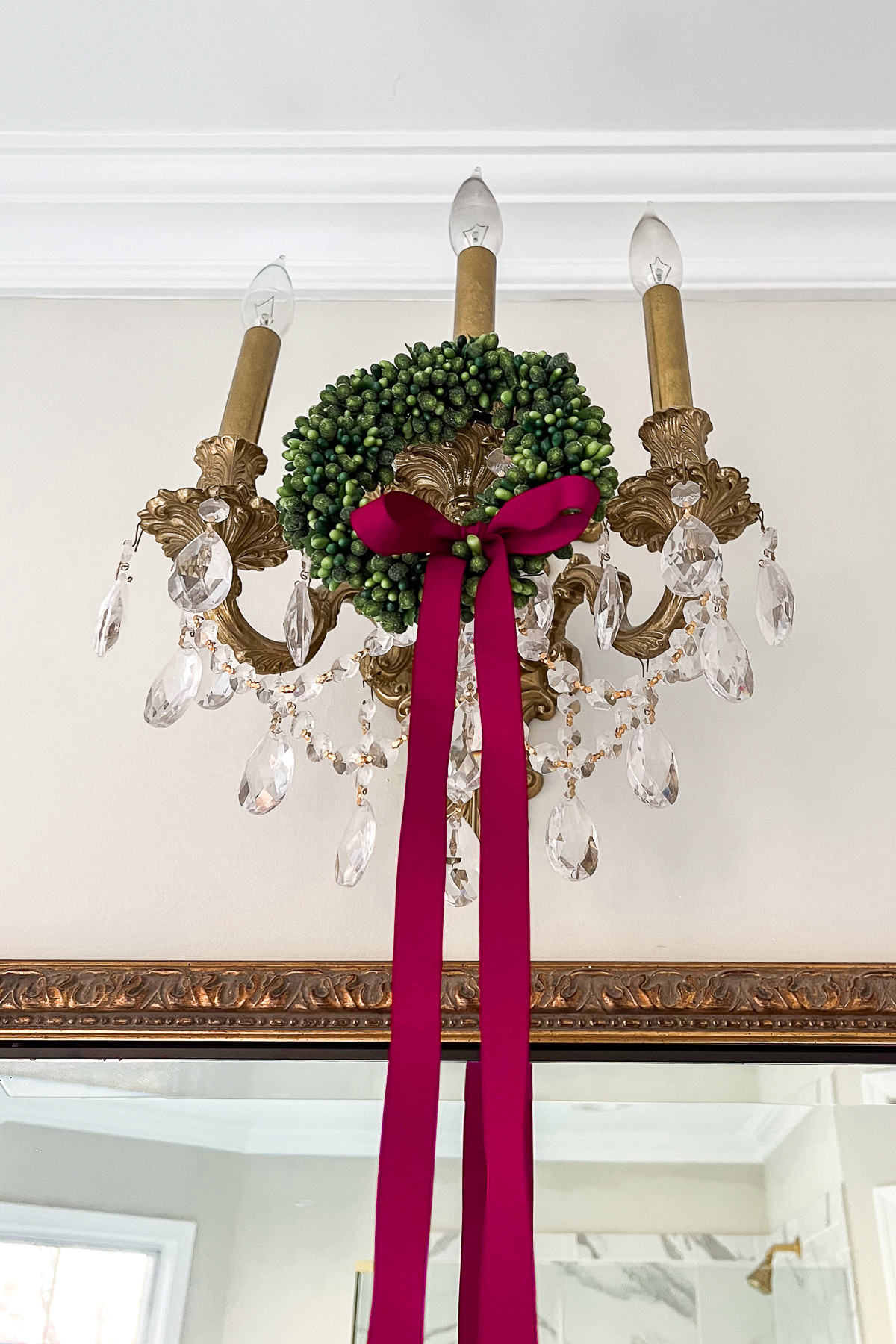 christmas decorations for the bathroom with mini wreaths on the sconces