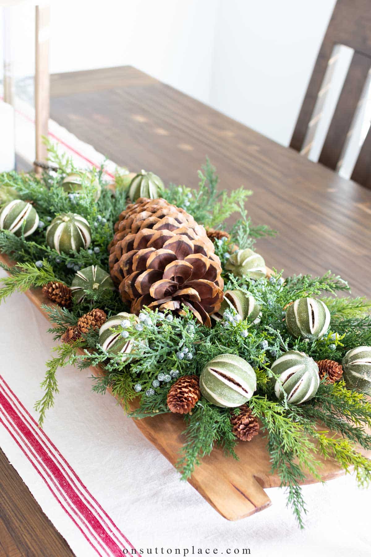 christmas greenery and dried limes in dough bowl